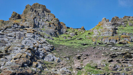 The ancient stone steps of Skellig Michael wind steeply up the island, leading to its historic monastery atop the rugged cliffs.