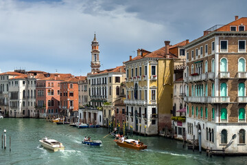 Gondola photo in Venice. Beautiful video with touristic taxi and local gondola boats cruising on the channels of Venice. Landmark landscape view of Italy.