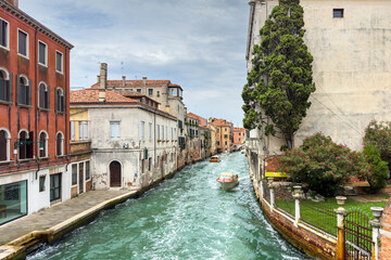 Gondola photo in Venice. Beautiful video with touristic taxi and local gondola boats cruising on the channels of Venice. Landmark landscape view of Italy.