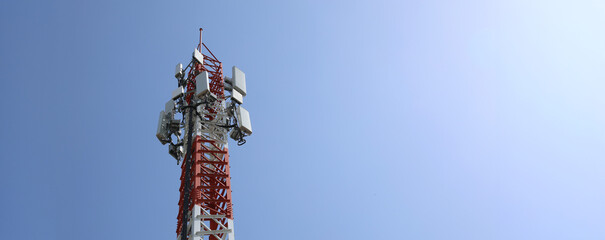 Communication tower top. Radio antenna Tower , microwave antenna tower on light sky background....