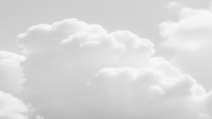 Obraz premium White Clouds from above. Aerial view of the fluffy white cloud on blue sky. Top view from an airplane over white clouds