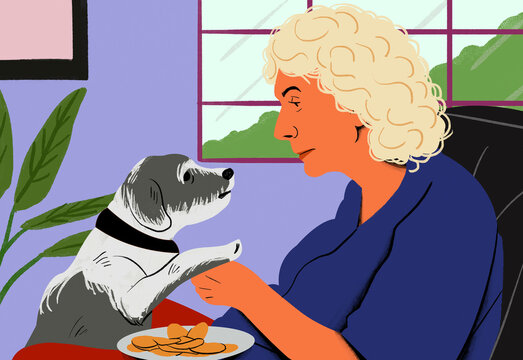 A curly-haired woman in blue shares a moment with a grey and white dog, possibly begging for treats at a table.