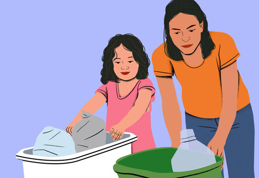 Mother and daughter doing laundry together with a girl learning to wash clothes as her mother supervises.