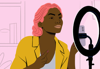 A confident person with pink hair poses in front of a ring light, getting ready for a video shoot or livestream.