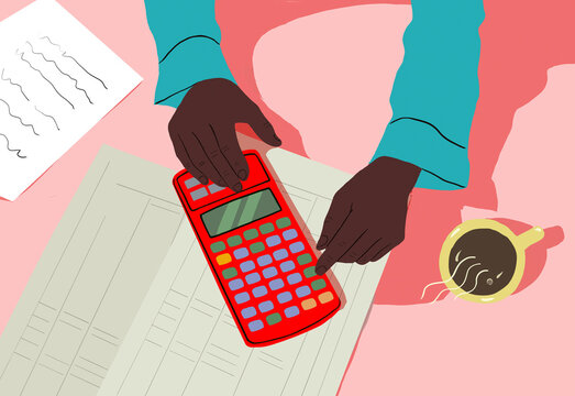 Hands using a red calculator over financial documents with a cup of coffee and notes on the side.