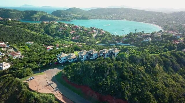 Panoramic view of Praia da Ferradura in B&uacute;zios, showcasing the calm waters and lush hills