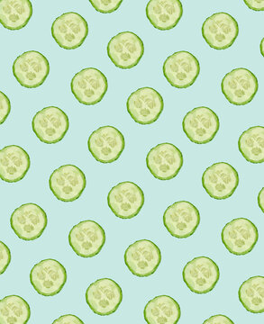 Seamless pattern of sliced cucumbers on a pastel green background.