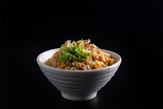 Japanese fried rice yakimeshi isolated in black background