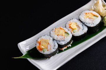 Futomaki maki rolls Japanese food isolate in black background