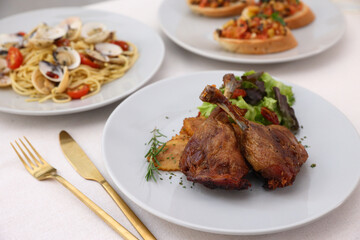 Duck leg confit with sauce. isolate in white background. top view. Duck confit on white plate