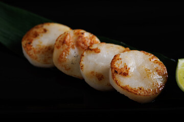 Grilled Japanese scallop grilled scallops Japanese Seafood Hokkaido japan Isolate in black background