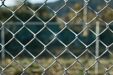 Fototapeta premium A close-up shot of a chain link fence with detailed texture and mesh pattern
