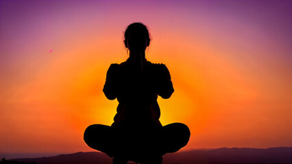Silhouette of a meditative man with buddhism elements, chakras and aura, in dhyana or samadhi mudra, lit by a light source creates sharp contrast, conveys calmness, peace and reflection