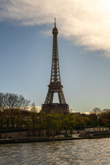 Paris Eiffel Tower and river Seine at sunset in Paris, France. Eiffel Tower is one of the most iconic landmarks of Paris