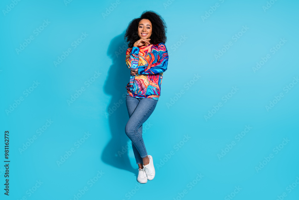 Poster Full body photo of attractive young woman minded toothy smile dressed stylish colorful clothes isolated on blue color background