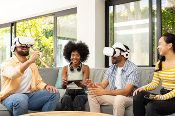 Using VR headsets, young diverse friends enjoying virtual reality gaming together
