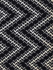 Black and white geometric pattern resembling a diagonal twill or houndstooth weave, ideal for backgrounds or texture overlays.