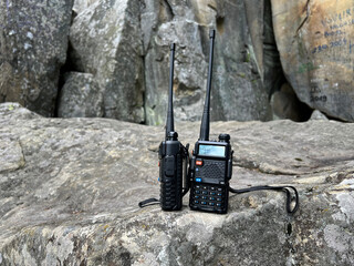 Walkie talkies on the rocky background. Concept of wireless communications. Off grid communication...