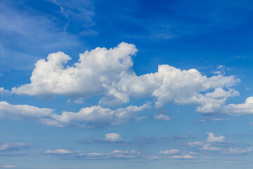 blue sky with puffy white clouds