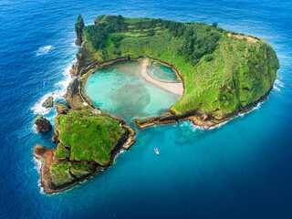 Aerial view of Ilheu de Vila Franca, a volcanic island near the Azores with a natural pool, ideal for swimming, snorkeling, and eco-tourism in a pristine coastal setting.