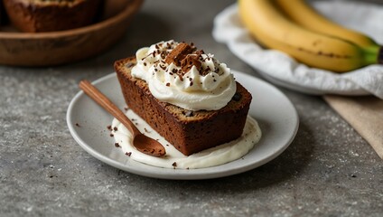 Chocolate chip banana bread topped with whipped cream and cinnamon.