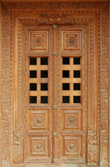 Authentic wood carving on the door of an Indian temple.