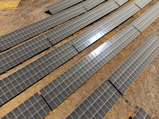 Aerial View of Solar Panels in a Field