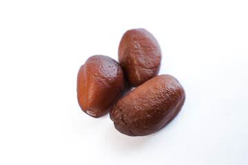 close-up of salak fruit seeds on a plain white background