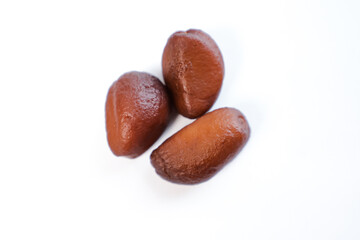 close-up of salak fruit seeds on a plain white background