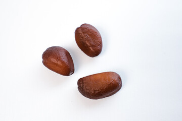 close-up of salak fruit seeds on a plain white background