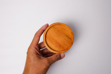 round wooden coasters with a plain white background