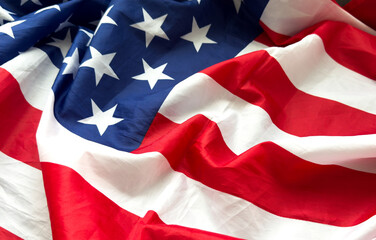 Close up of ruffled American flag. Satin texture curved flag of USA. Memorial Day or 4th of July....