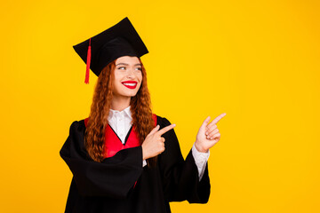 Photo of girl graduate wear black robe recommend empty space news banner isolated on yellow color background