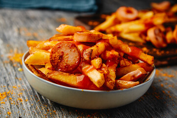 typical german dish currywurst and chips
