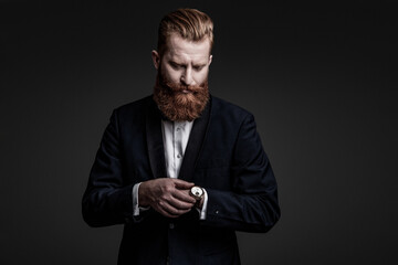 Punctual man check time on watch being late. Elegant watch accessory. Punctual man checking time isolated on grey. Male accessory. Gentleman in bowtie late for meeting. Copy space