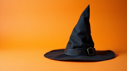 Fototapeta premium Black witch hat isolated on orange background with copy space, generative AI