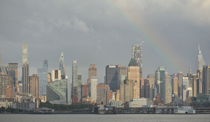 rainbow over the west side of manhattan new york city skyline (residential and commercial...