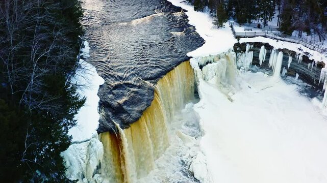 Flyover Tilt Down Freezing Waterfall