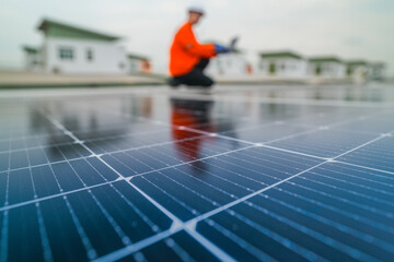 engineer man inspects construction of solar cell panel or photovoltaic cell by electronic device....