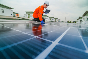 engineer man inspects construction of solar cell panel or photovoltaic cell by electronic device....