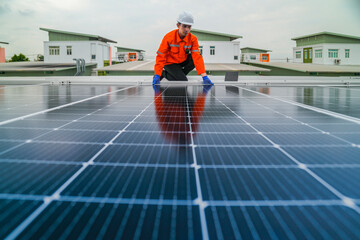 engineer man inspects construction of solar cell panel or photovoltaic cell by electronic device....