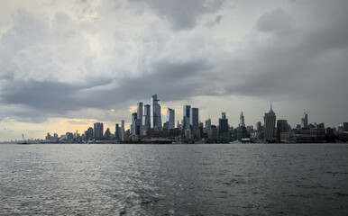 view of midtown manhattan frm weehawken waterfront (hudson river west new york city skyline skyscrapers sightseeing travel tourism destination) nyc dramatic sky harbor vista scenic buildings nj jersey