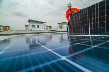 engineer man inspects construction of solar cell panel or photovoltaic cell by electronic device....