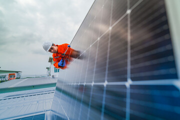 engineer man inspects construction of solar cell panel or photovoltaic cell by electronic device....