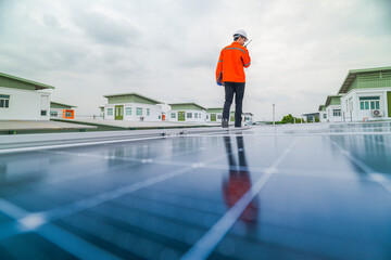 engineer man inspects construction of solar cell panel or photovoltaic cell by electronic device....