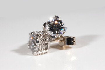 Diamond earrings. Big diamond earrings, large solitaire earrings on white background.