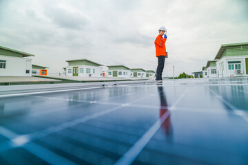 engineer man inspects construction of solar cell panel or photovoltaic cell by electronic device....