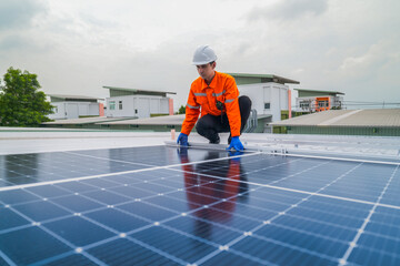 close up on grid of technology renewable solar energy. construction solar panels system on roof. Installing solar photovoltaic panel system. background of blue of solar cell system and structure roof.