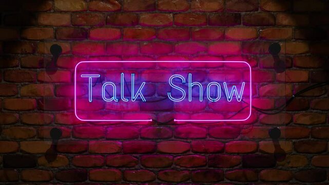 Talk show with glowing neon sign with blue and pink lights, mounted on a rustic brick wall, creating a vibrant and modern atmosphere