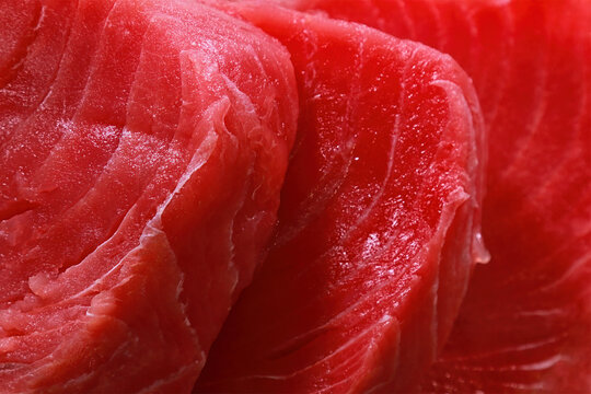 Background image. Sliced ​​red tuna fillet. Selective focus